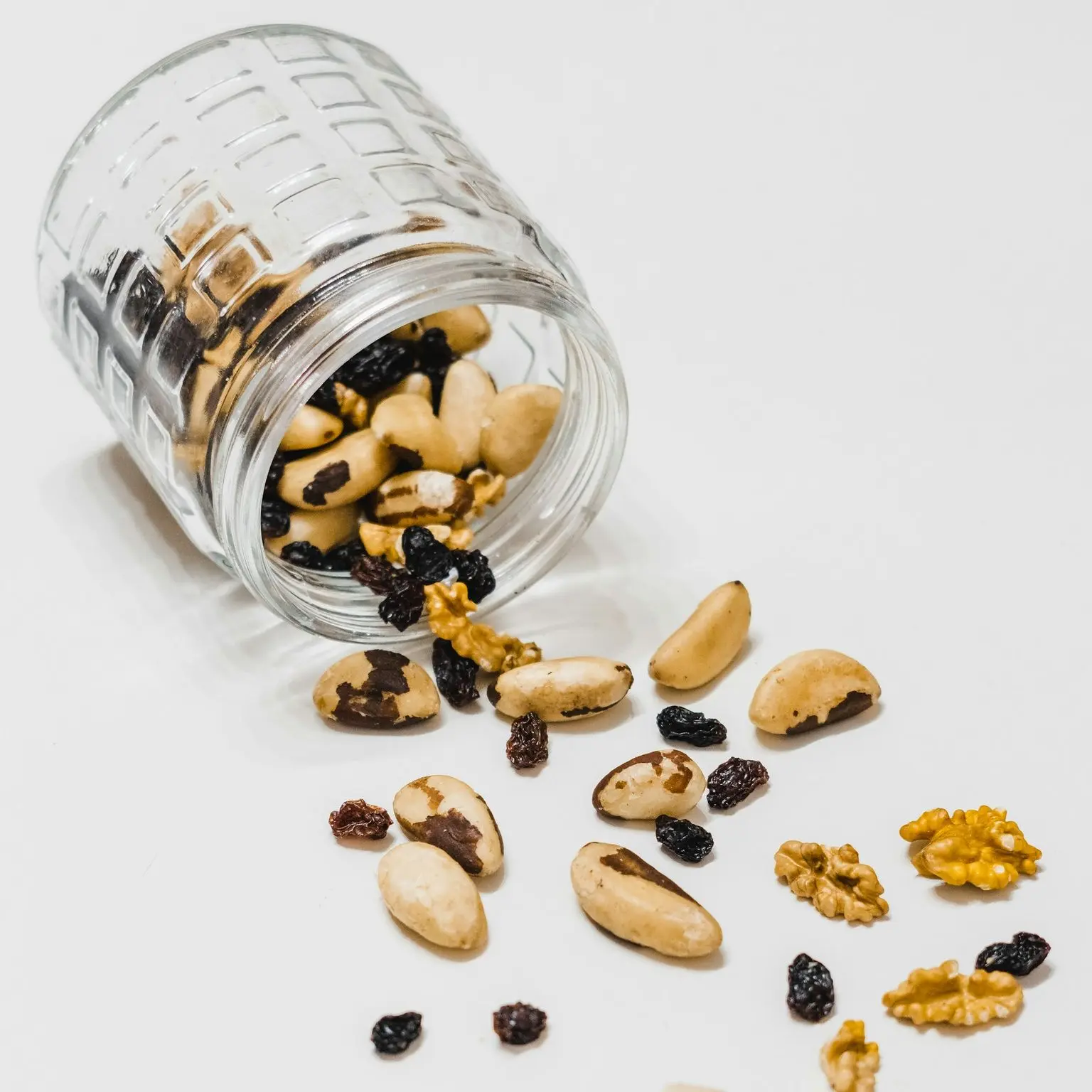 brown coffee beans on clear glass jar