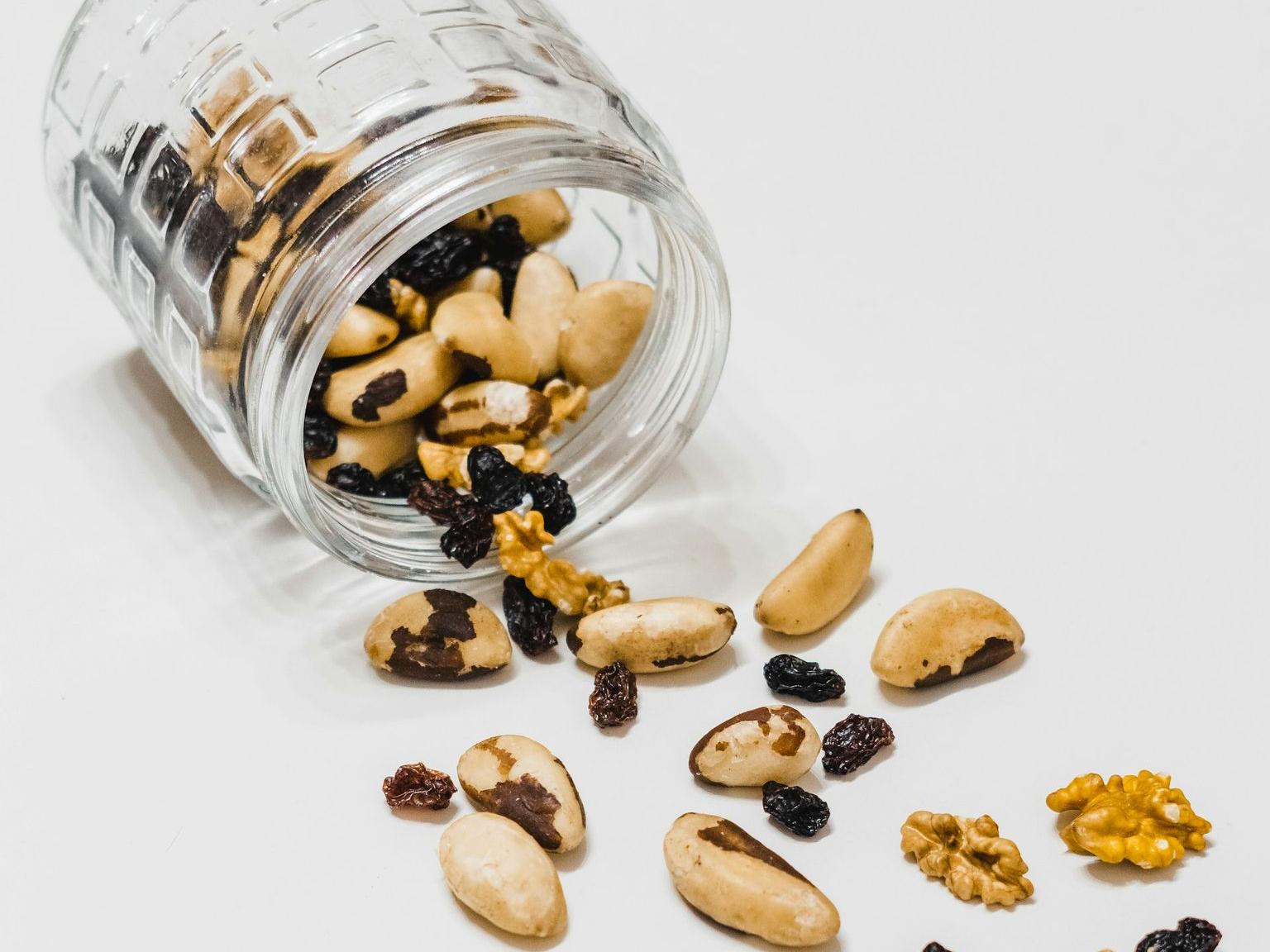 brown coffee beans on clear glass jar